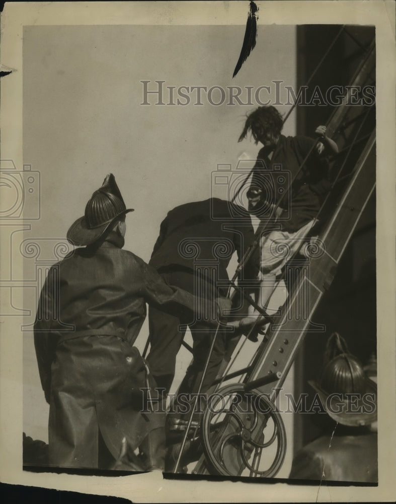 1937 Press Photo Firemen Rescuing Someone with Raised Ladder - neo22684