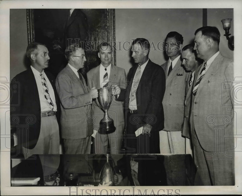 Load image into Gallery viewer, 1939 Press Photo Winners of Treasury Department Pistol Match Receive Cup
