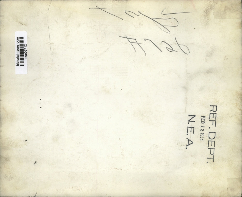 1934 Press Photo A young boy fixes a chair in a workshop - nep06712