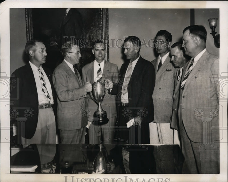 Load image into Gallery viewer, 1939 Press Photo Winners of Treasury Department Pistol Match Receive Cup
