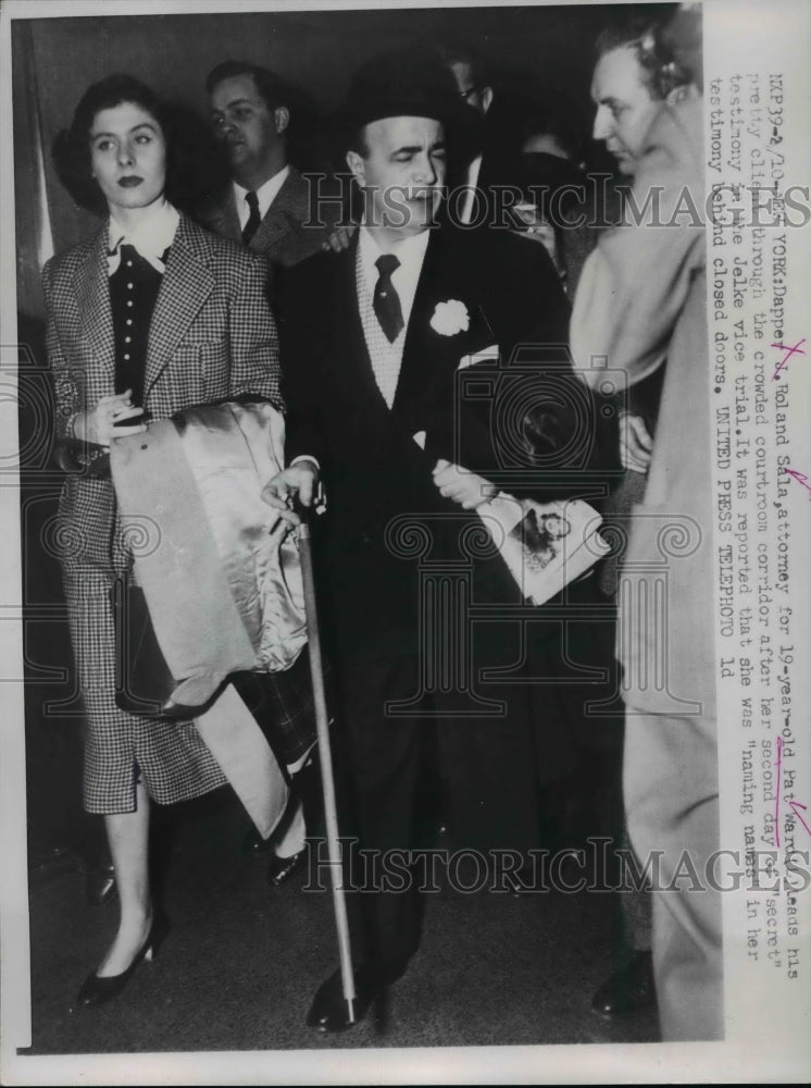 Load image into Gallery viewer, 1953 Press Photo Atty. J. Roland Sala &amp; Witness Pat Ward Walk Through Courtroom
