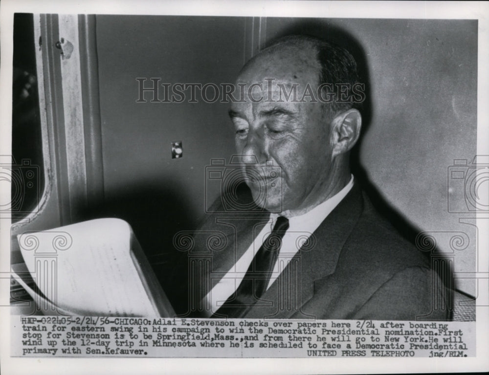 1956 Press Photo Adlai Stevenson on Train Reading Papers After Primary Swing- Historic Images