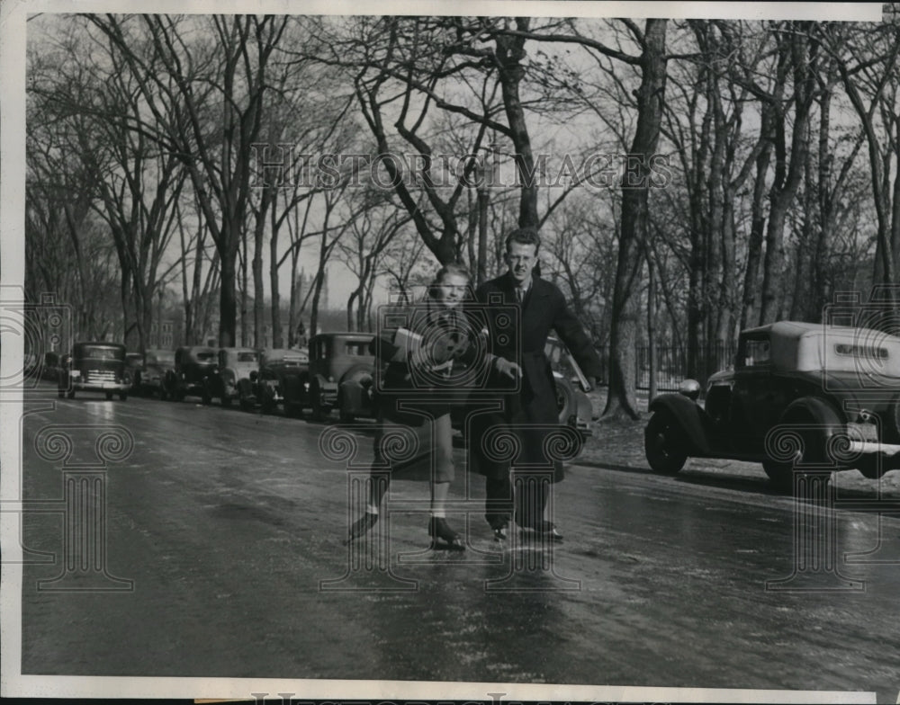 1935 Press Photo NW Univ students skating on a frozen street Evanston Ill- Historic Images