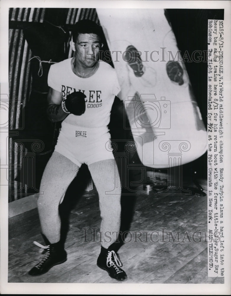 1951 Press Photo Ferndale NY Middleweight champ Randy Turpin trains on bag- Historic Images