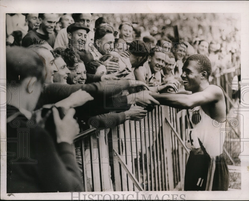 1937 Press Photo Ben Johnson American sprint stae at France meet - nes30390- Historic Images