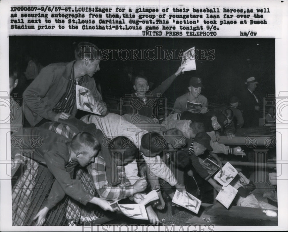 1957 Press Photo Youngsters lean over rail at Busch Stadium to get autographs- Historic Images