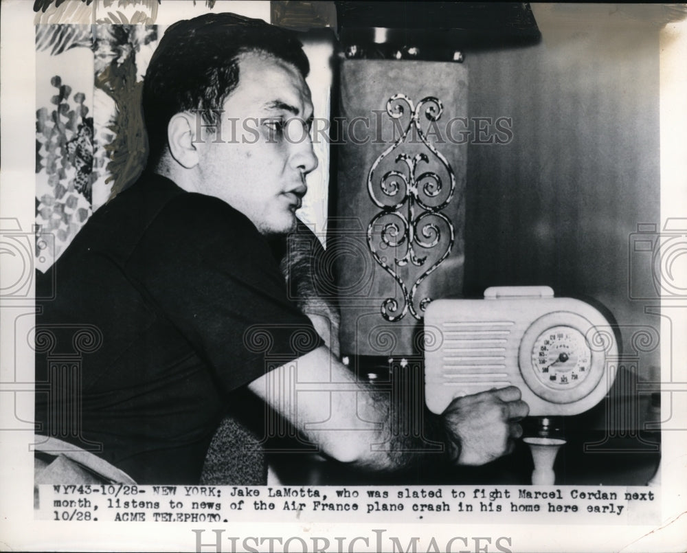 1949 Press Photo Jake LaMotta listens to news of plane crash - nes31639- Historic Images