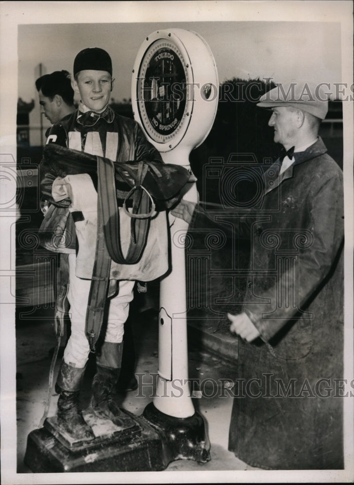 1940 Press Photo Apprentice jockey Jack Flinchim weighs in for race - nes31901- Historic Images