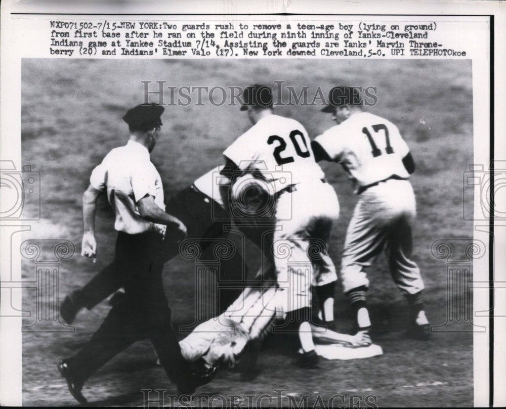 1959 Press Photo Guards remove a boy on field at Yankee vs Indian game in NYC- Historic Images