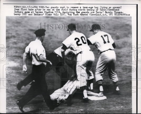 1959 Press Photo Guards remove a boy on field at Yankee vs Indian game in NYC- Historic Images