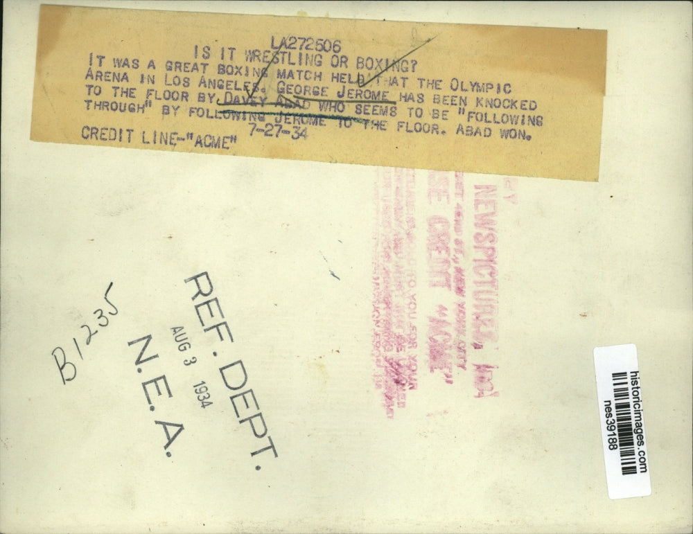 1934 Press Photo George Jerome downed by Davey Asad in bout at Olymoic Arena