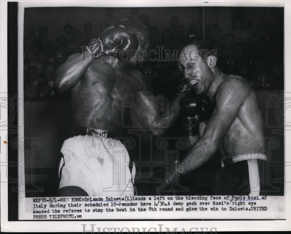 1954 Press Photo Orlando Zulueta throws left at Paolo Rosi at NYC bout- Historic Images