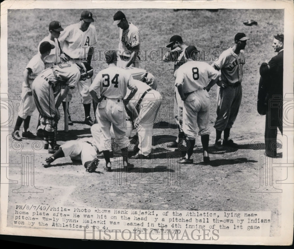 1949 Press Photo Hank Majeski of Athletics hit by pitch of Indians Early Wynn- Historic Images