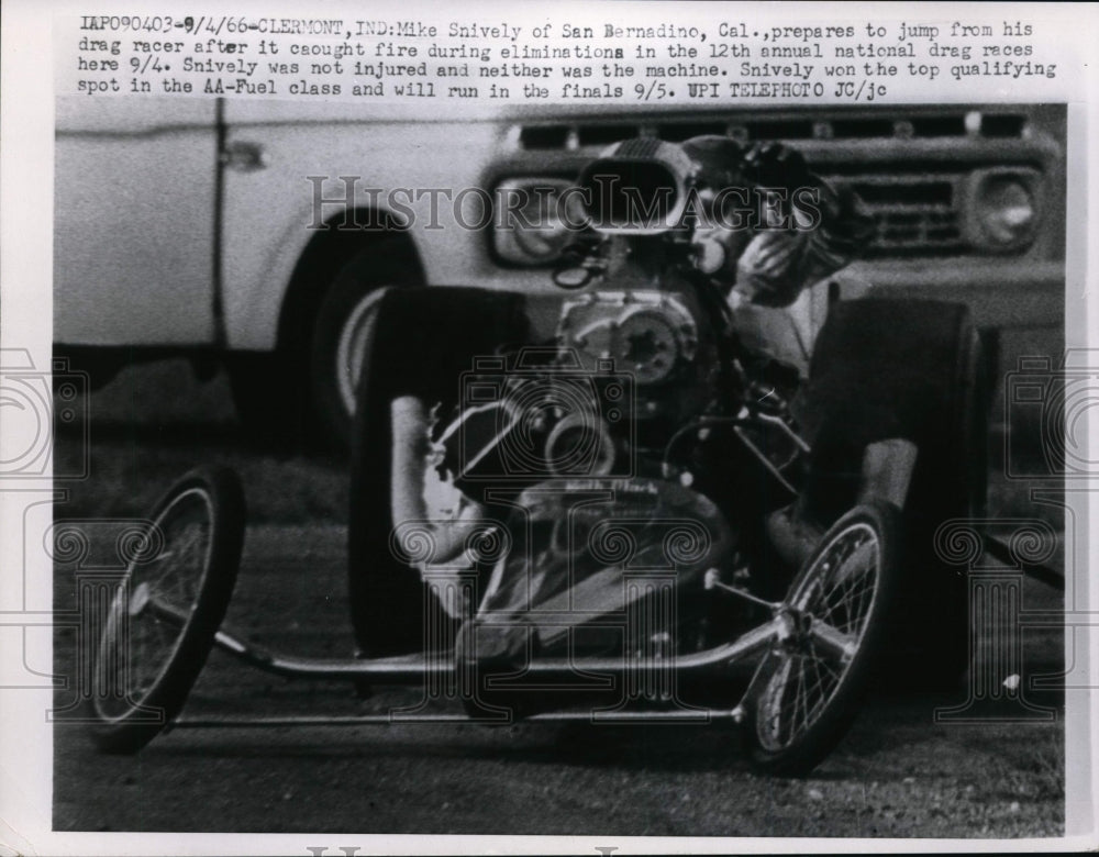 1966 Press Photo Mike Snively jumps from drag racer fire at Clermont Indiana- Historic Images