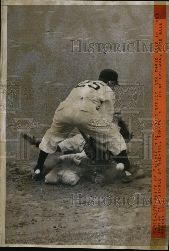 1944 Press Photo White of Philadelphia slides to 3rd vs Tornes in baseball game- Historic Images