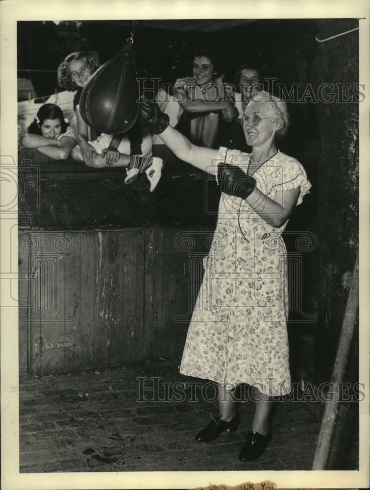 1938 Press Photo Mrs. Mary Sullivan punches a bag to help with rheumatism- Historic Images