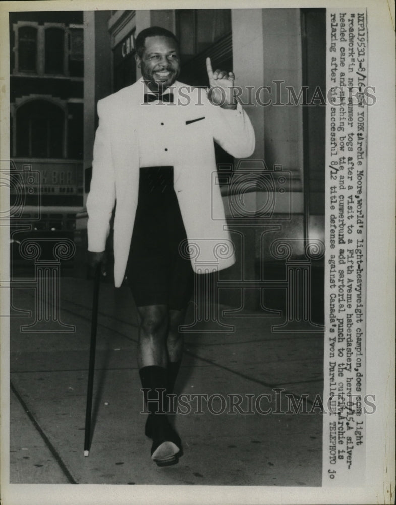 1959 Press Photo Boxer Archie Moore after visiting Fifth Avenue haberdashery, NY- Historic Images