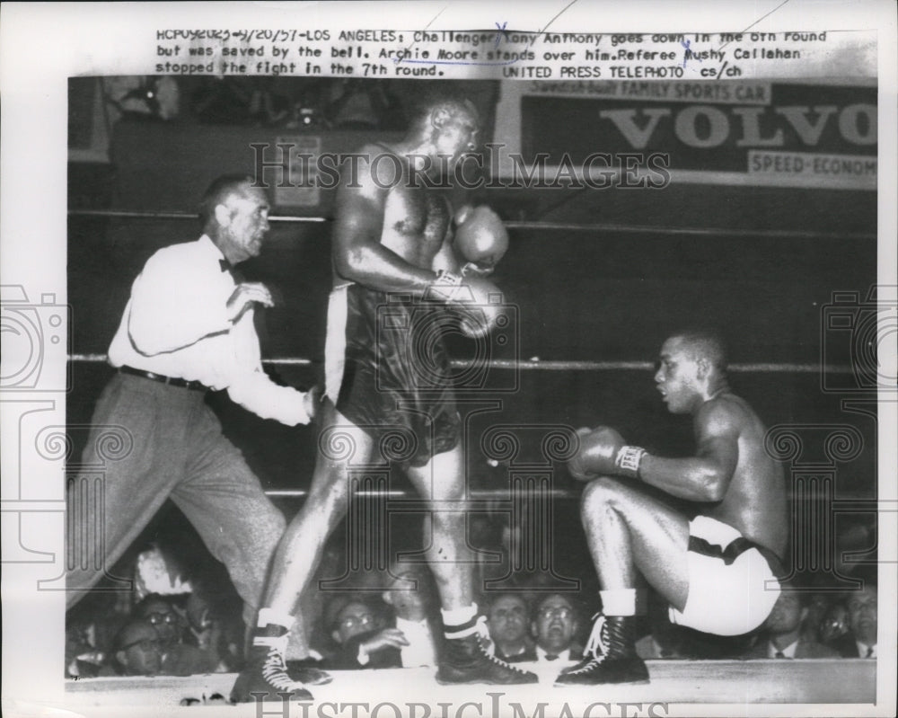 1957 Press Photo Boxer Archie Moore knocks down challenger Tony Anthony- Historic Images