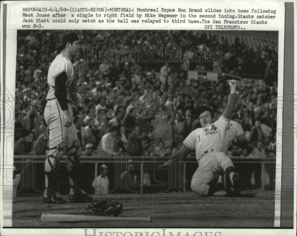 1969 Press Photo Ron Brand of Montreal Expos slides in safely at home- Historic Images