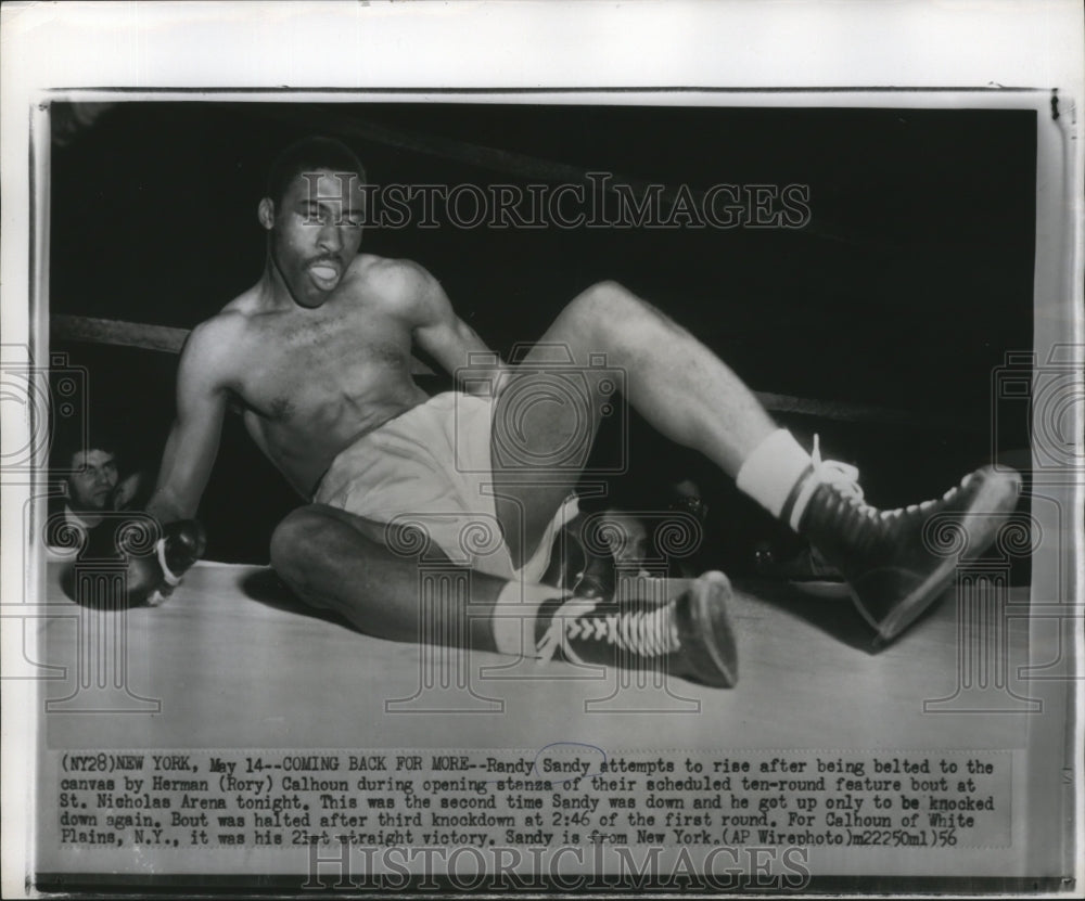 1956 Press Photo Boxer Randy Sandy tries to recover from Herman Calhoun punch- Historic Images