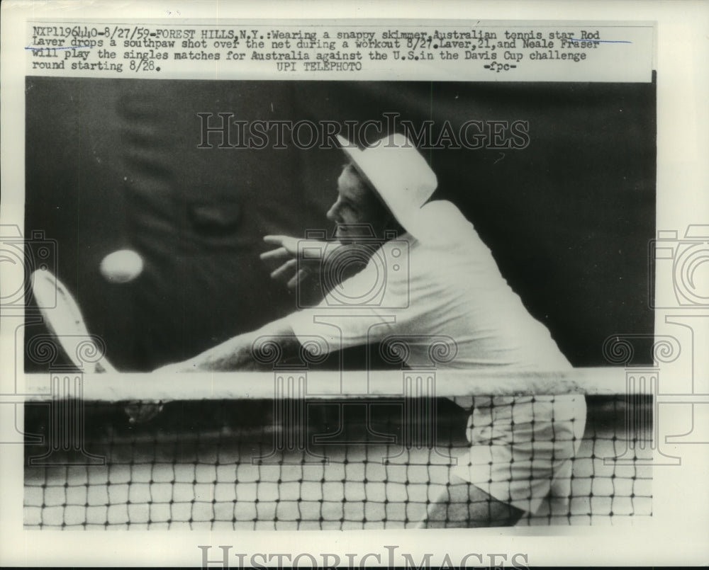 1959 Press Photo Australian tennis star Rod Laver drops southpaw shot over net- Historic Images