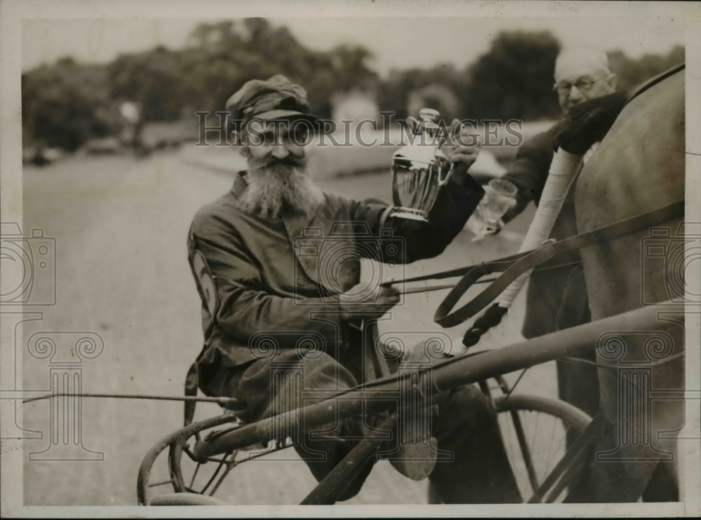 1938 Press Photo Pat O'Connell holding trophy on board "Kelly" - net04797- Historic Images