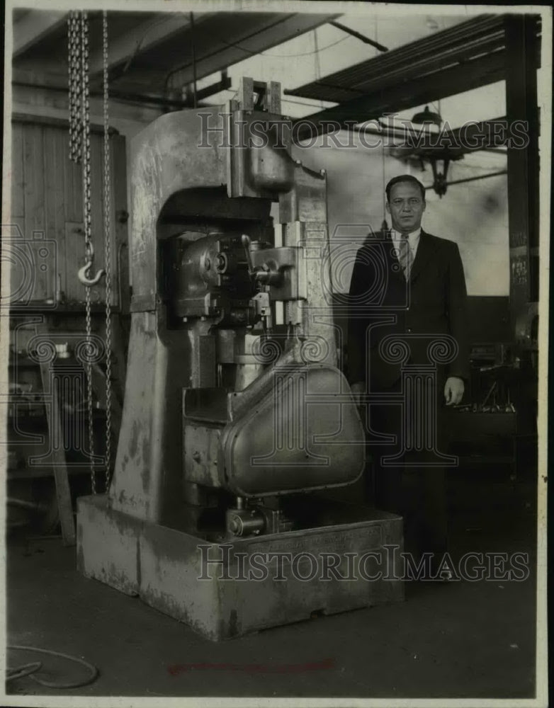 1937 Press Photo Charles Schwarz in a factory with machinery - net05655- Historic Images