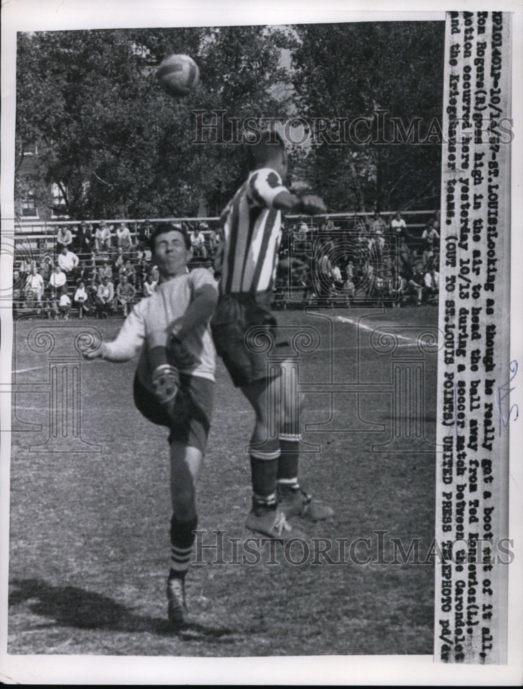 1957 Press Photo Tom Rogers heads ball away from Ten Knoseicz in St. Louis- Historic Images