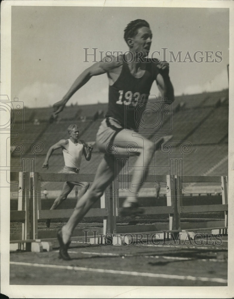 1928 Press Photo Track sprinter clears hurdles in a race at a meet - net12269- Historic Images