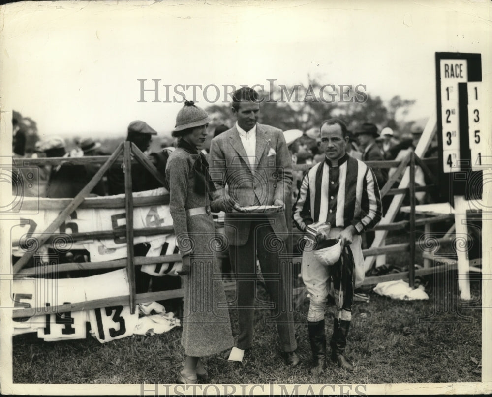 1933 Press Photo A jockey recieves race plate trophy at a track - net15160- Historic Images