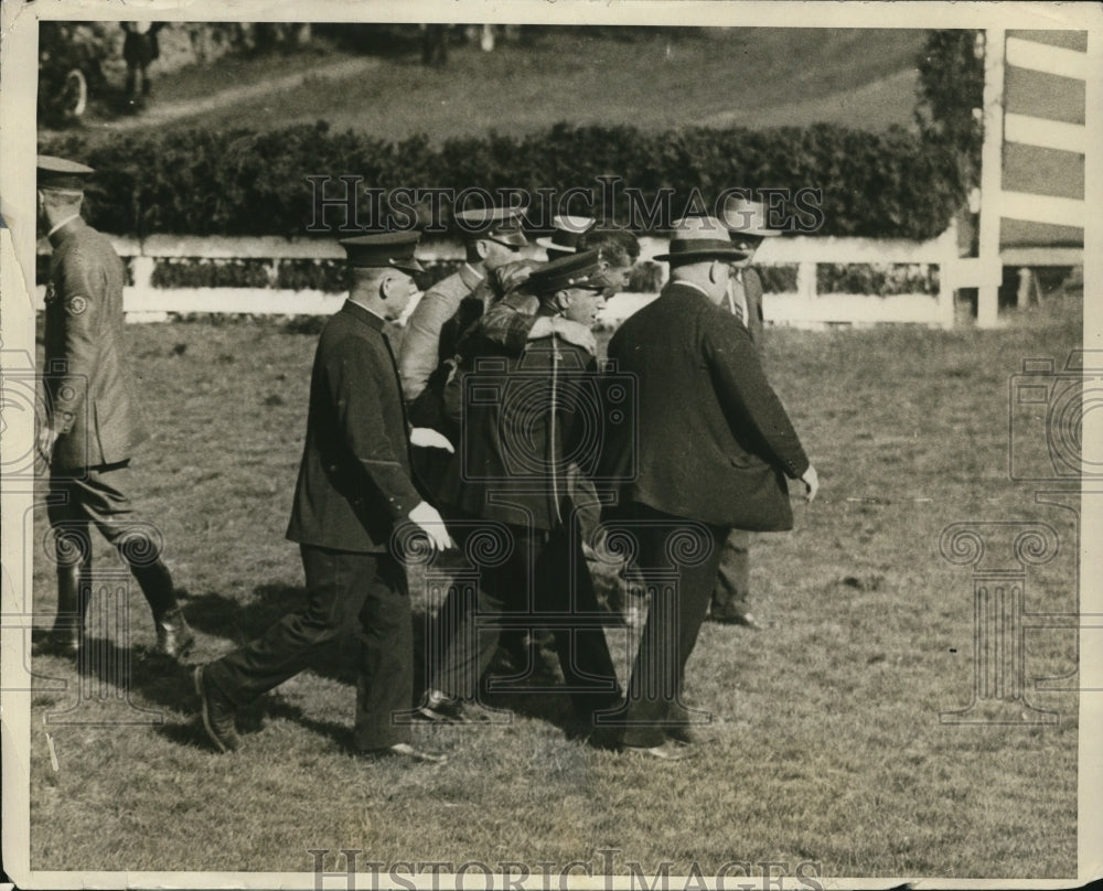 1926 Press Photo Jockey T Madden carried from track after thrown by Gold Seal- Historic Images