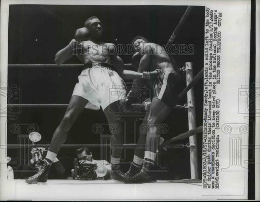 1957 Press Photo Randy Sandy lands a solid left to body of Spider Webb- Historic Images