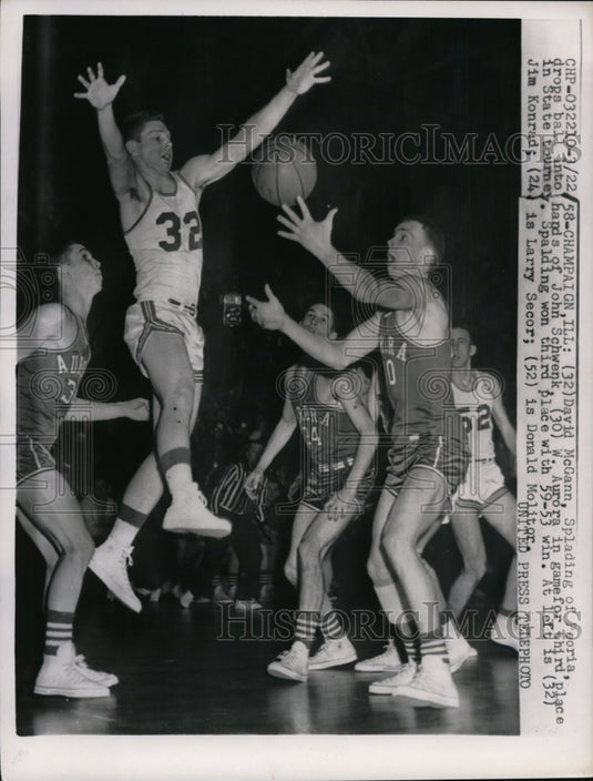 1958 Press Photo David McCann of Spalding drops ball to Schwenk of Aurora- Historic Images