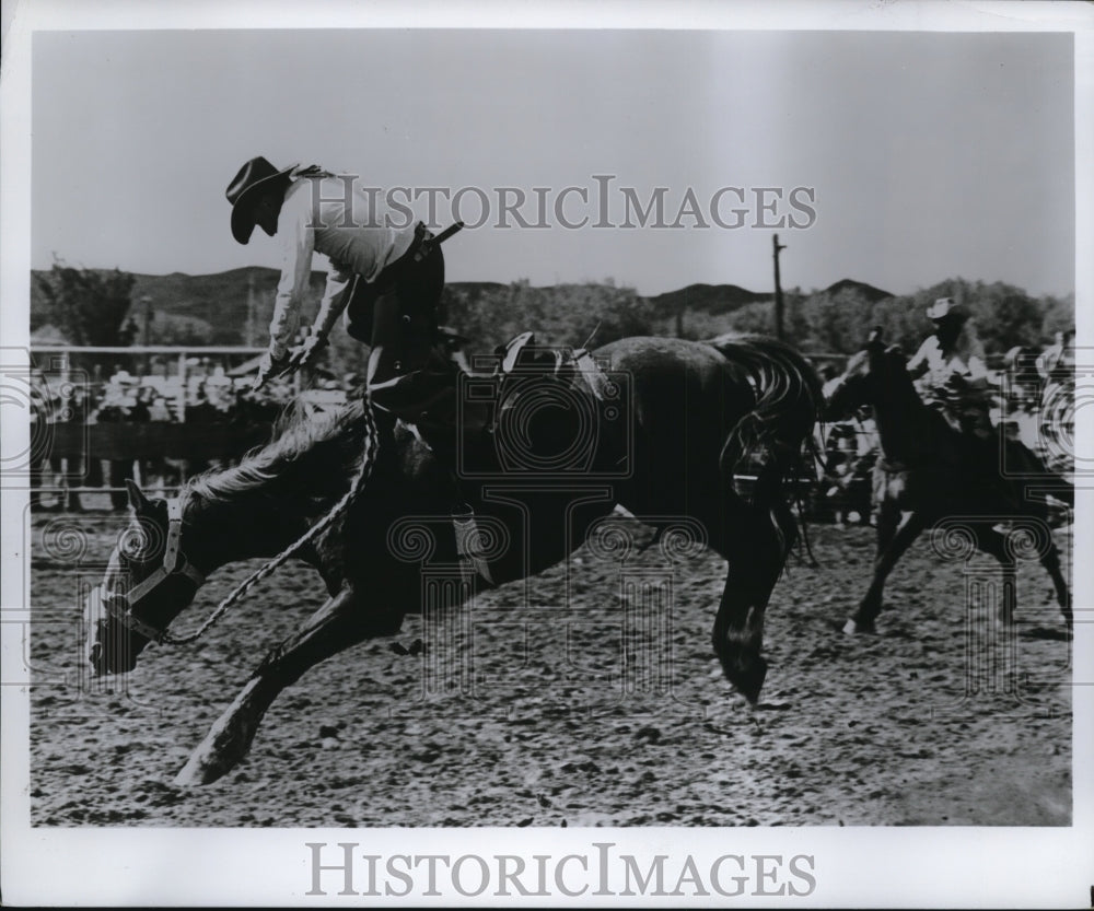 Press Photo A rodeo cowboy on a bucking bronco - net29627- Historic Images