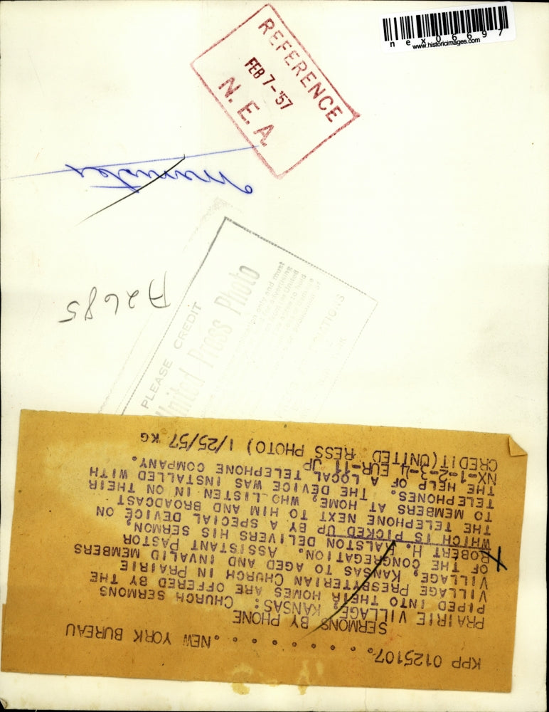 1957 Press Photo Pastor Robert H.Ralston delivered his sermon by a Telephone.