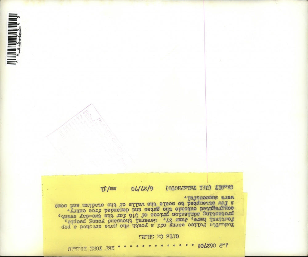 1970 Press Photo Police carrying a youth that gate crashed pop festival