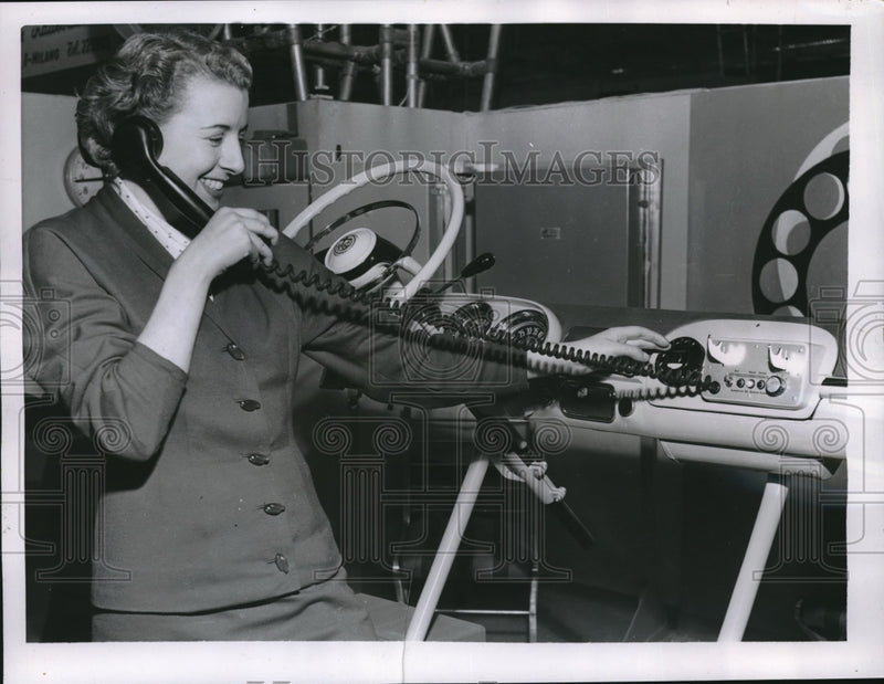 Load image into Gallery viewer, 1955 Press Photo A visitor trying the Autophone during the 33rd industrial fair
