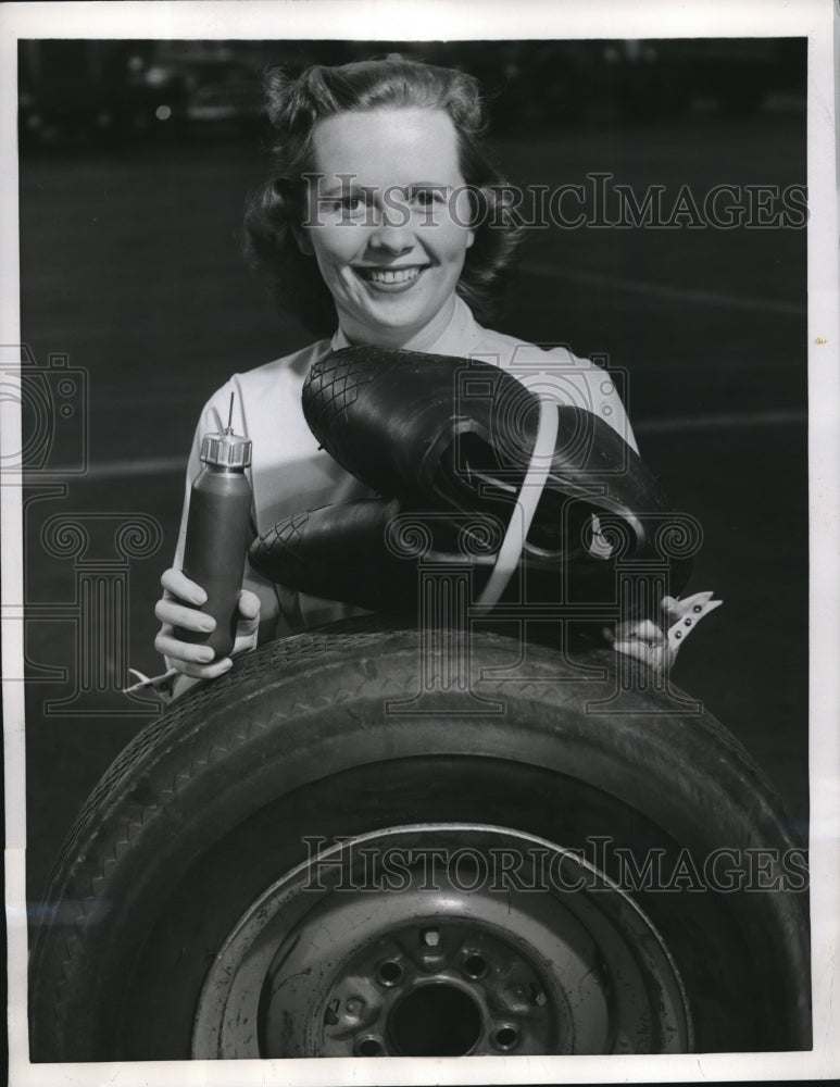 1956 Press Photo Gates Rubber Employee Delores Sturgis With Spare Tires- Historic Images