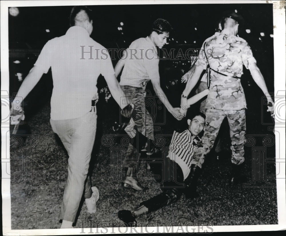 1969 Press Photo Riot Police Drag Student Demonstrator Away During Riots
