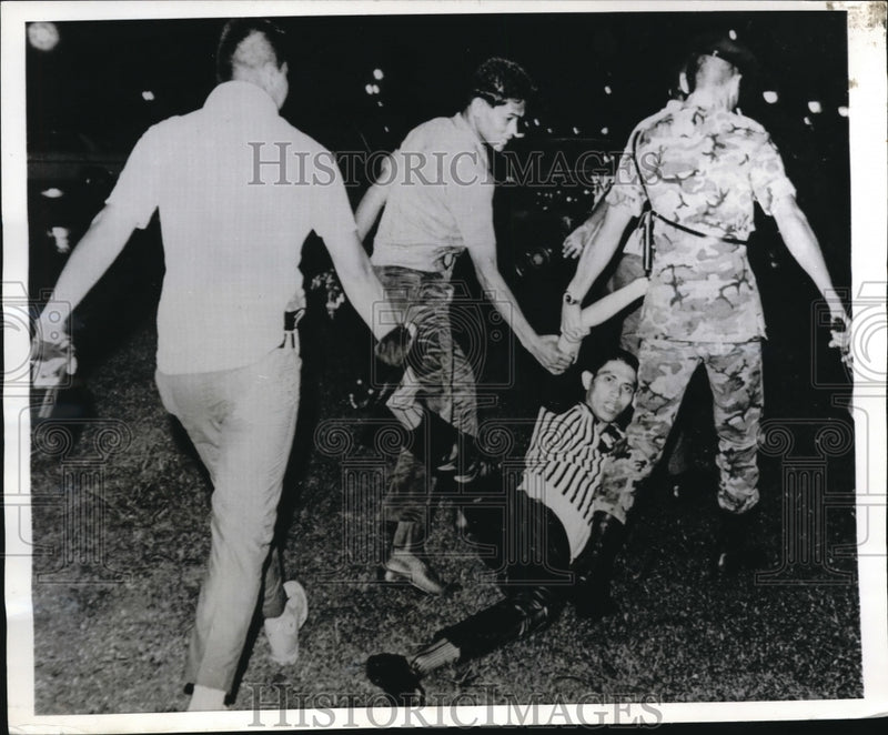 Load image into Gallery viewer, 1969 Press Photo Riot Police Drag Student Demonstrator Away During Riots
