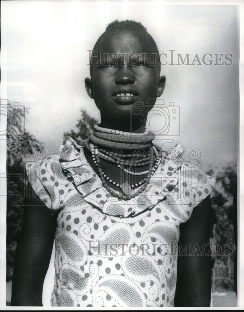 1963 Press Photo In blend of cultures this Sudanese girl wears western dress