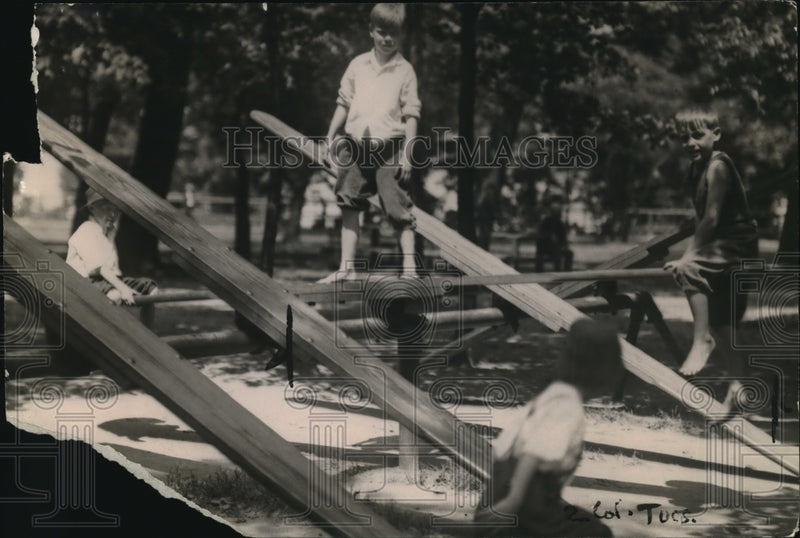 Load image into Gallery viewer, 1920 Press Photo Kids Playing On Teeter-Totter Having Some Summer Fun
