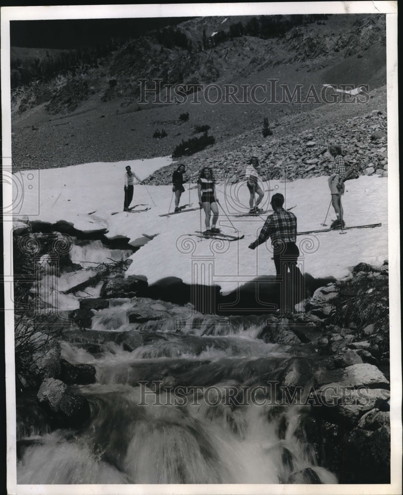 Load image into Gallery viewer, 1947 Press Photo one skier draws attention of his companions as he takes to
