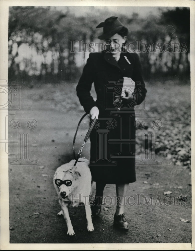 1938 Press Photo Geneva Switzerland Whitey the dog & his mistress on a walk