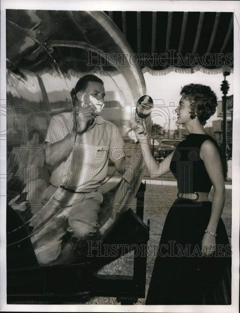 1955 Press Photo Walter Atkinson assisted by Rolane Johnson part of a stunt for