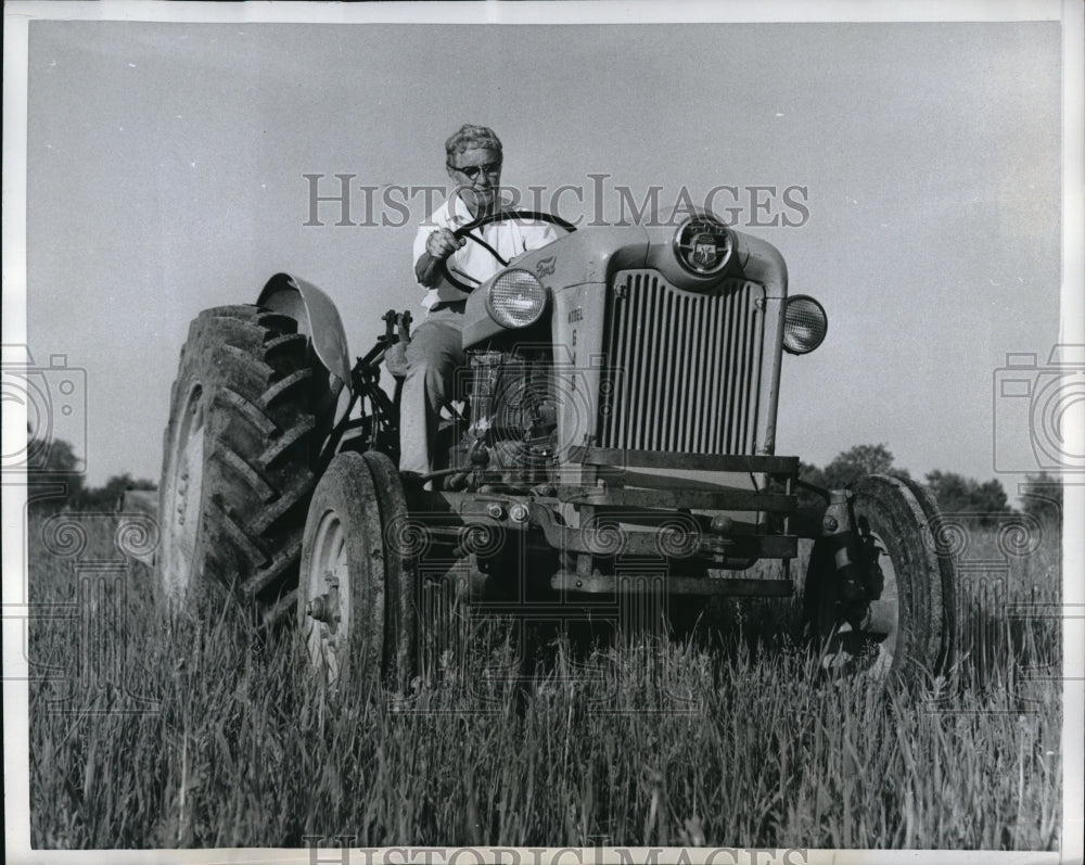 1959 Press Photo Mrs Lyon on a farm tractor in pastureland
