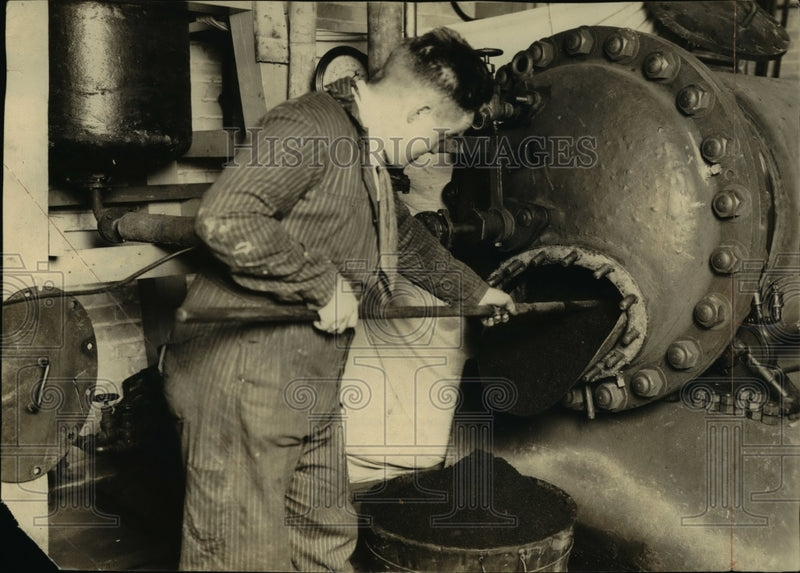 Load image into Gallery viewer, 1924 Press Photo Worker Pulls Hydrolized Sawdust from Factory Retort
