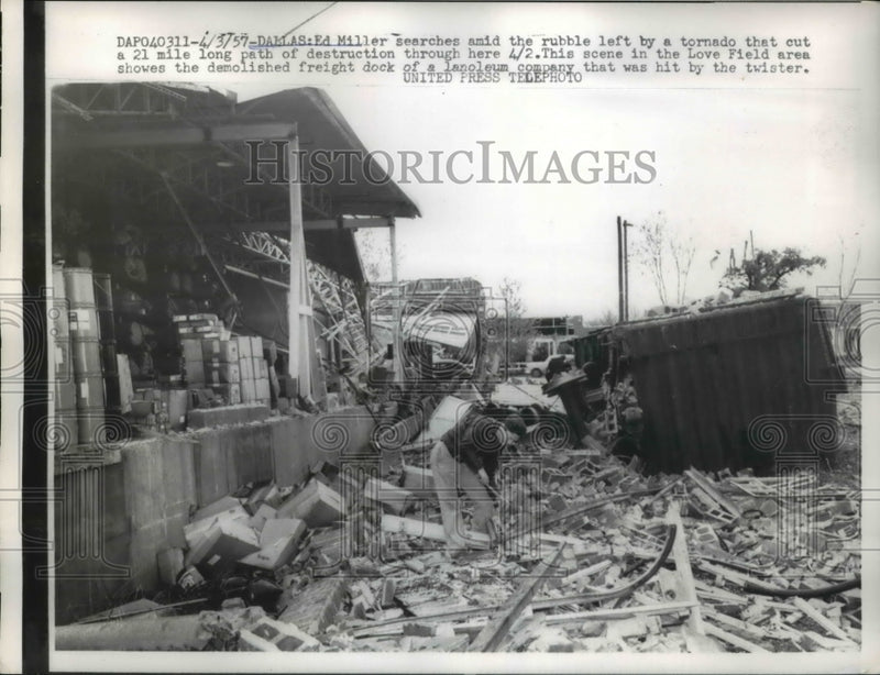 Load image into Gallery viewer, 1957 Press Photo Ed Miller Searches Rubble left by Tornado Dlass
