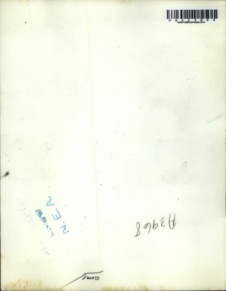 1949 Press Photo Gloves with Money Pouch Displayed at Bus Stop Sign