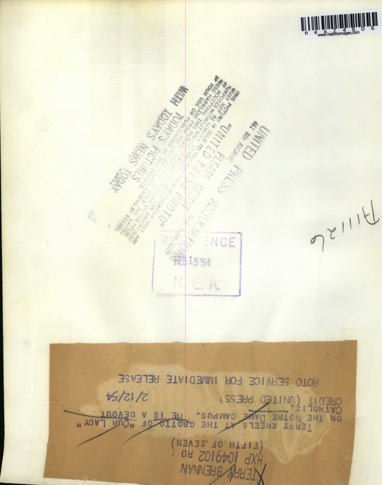 1954 Press Photo Terry kneels at grotto of Our Lady on Notre Dame campus